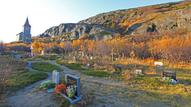 King Oscar II chapel in Grense Jakobselv, with a 19th-century graveyard in foreground.