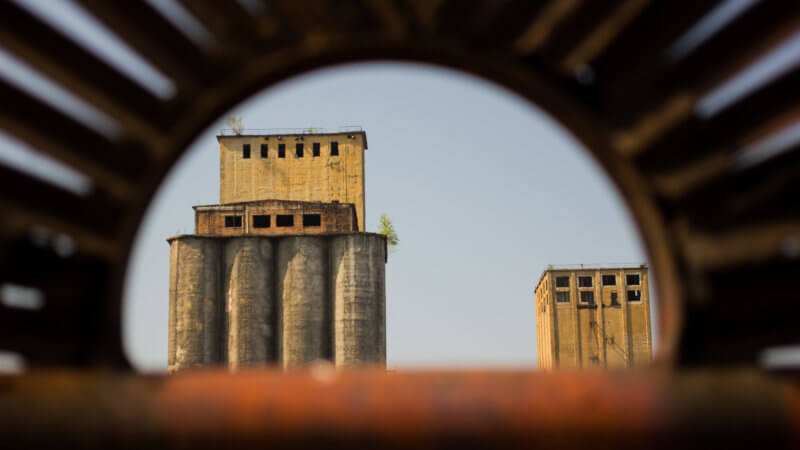 The tall towers and grain silo of a disused bread factory in Kyzyl, Tuva.