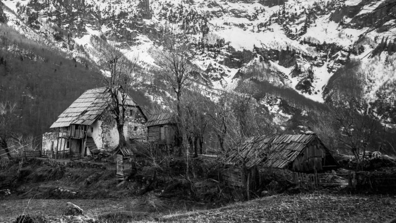 Black and white photo of an Albanian mountain farm.