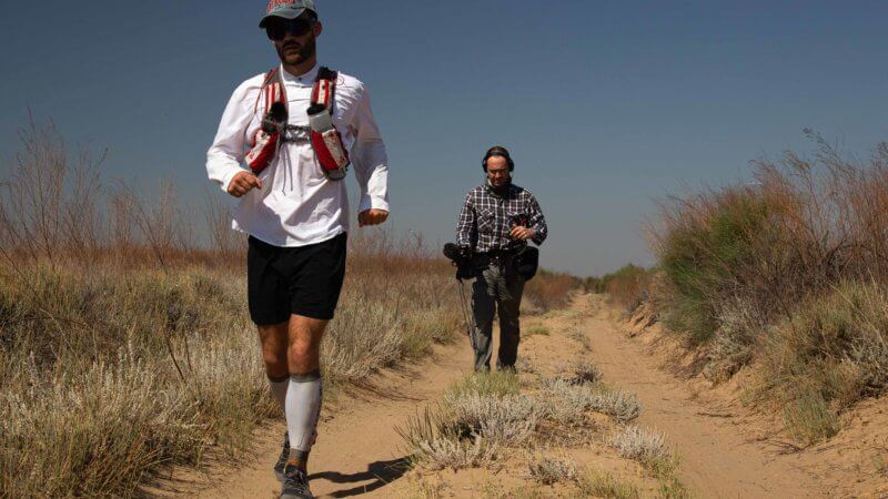 Camerman and photographer Mark Woodward filming Jamie Maddison during his run across the Saryesik Atyrau desert in Kazakhstan.