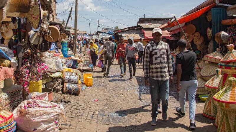 A busy market in Addis Ababa with baskets for sale.