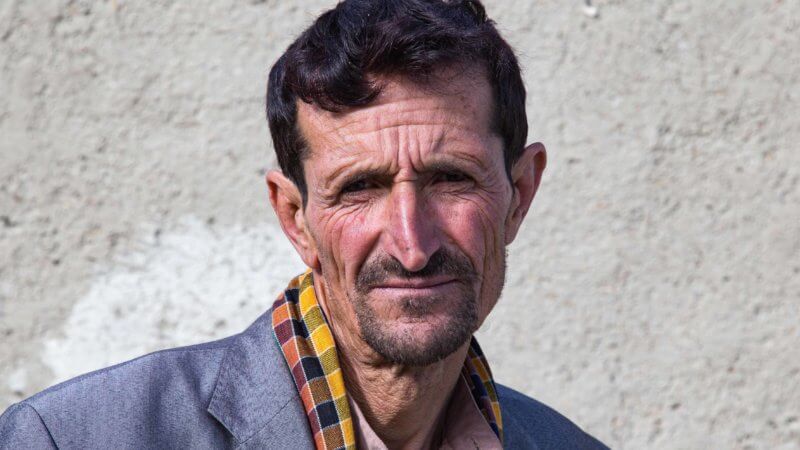 Portrait of hostel owner in Ishkishim.