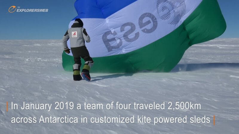 Screenshot of an Antarctic explorer launching a giant kite to power their sled.